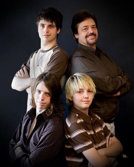 A picture of Jay Osmond with his three sons.